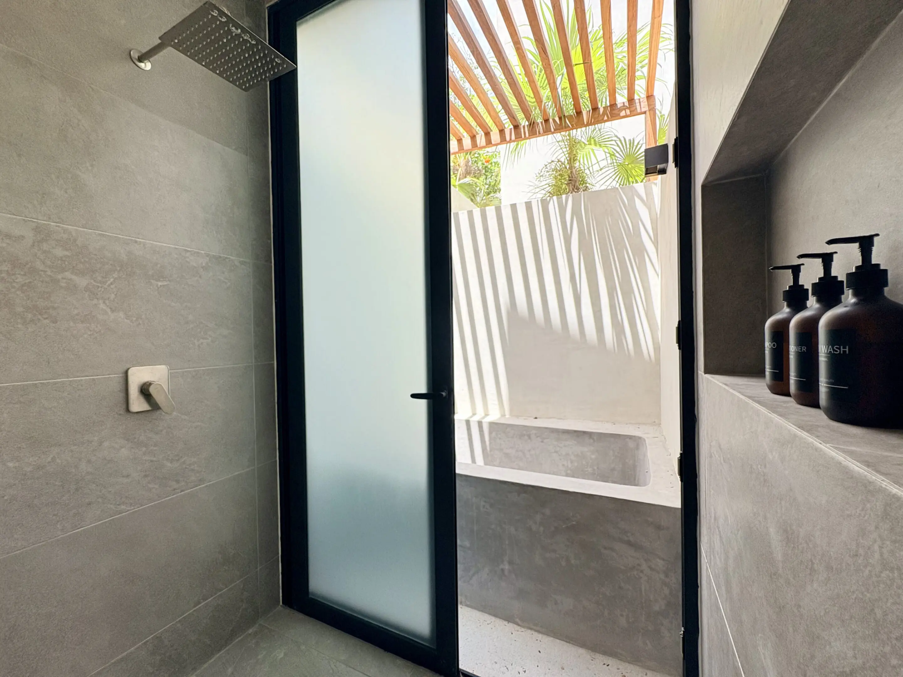 Modern shower opening to outdoor bathtub