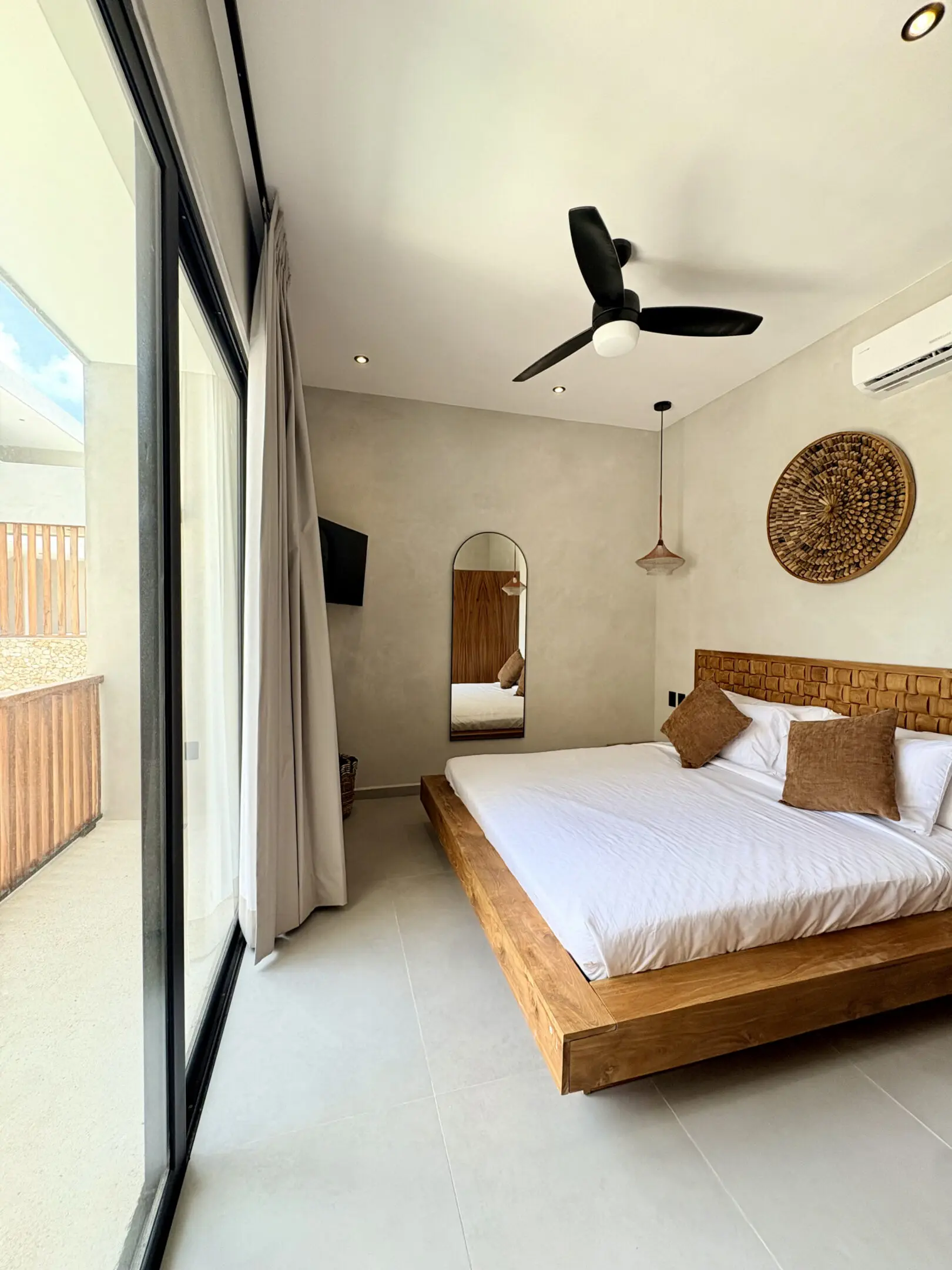 Modern minimalist bedroom with wooden platform bed