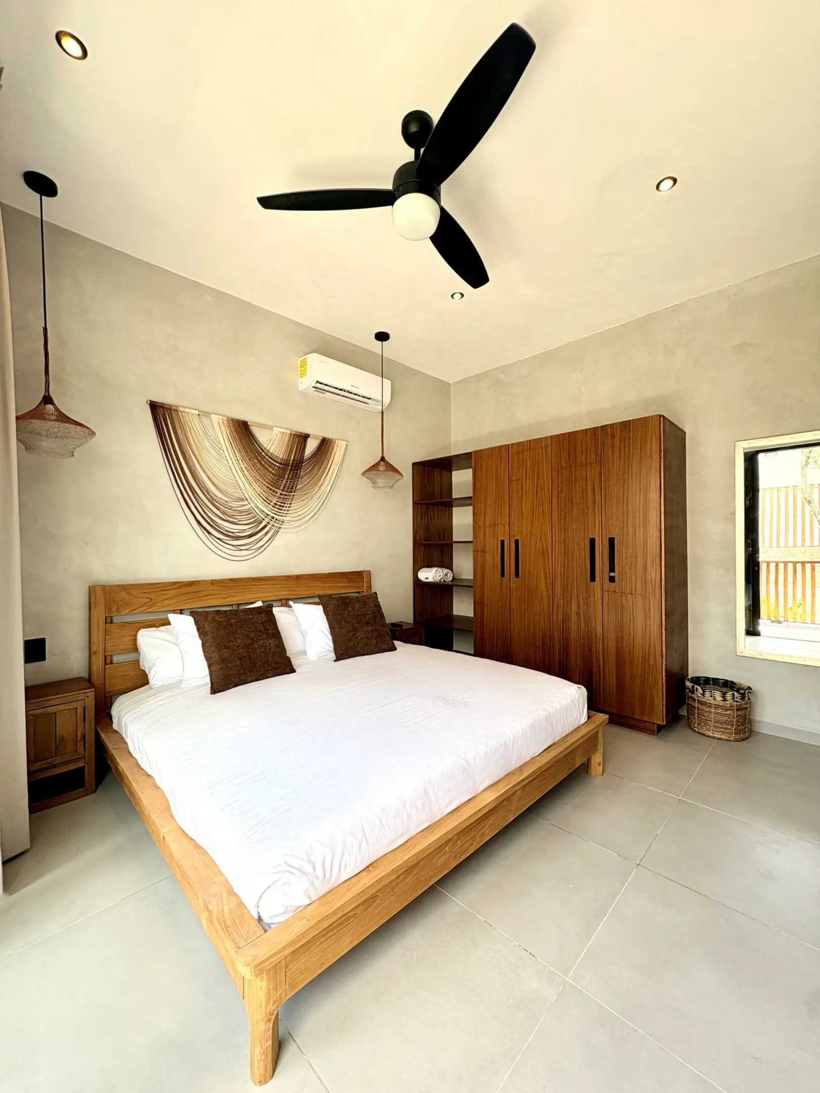 Minimalist bedroom with wooden bed and wardrobe