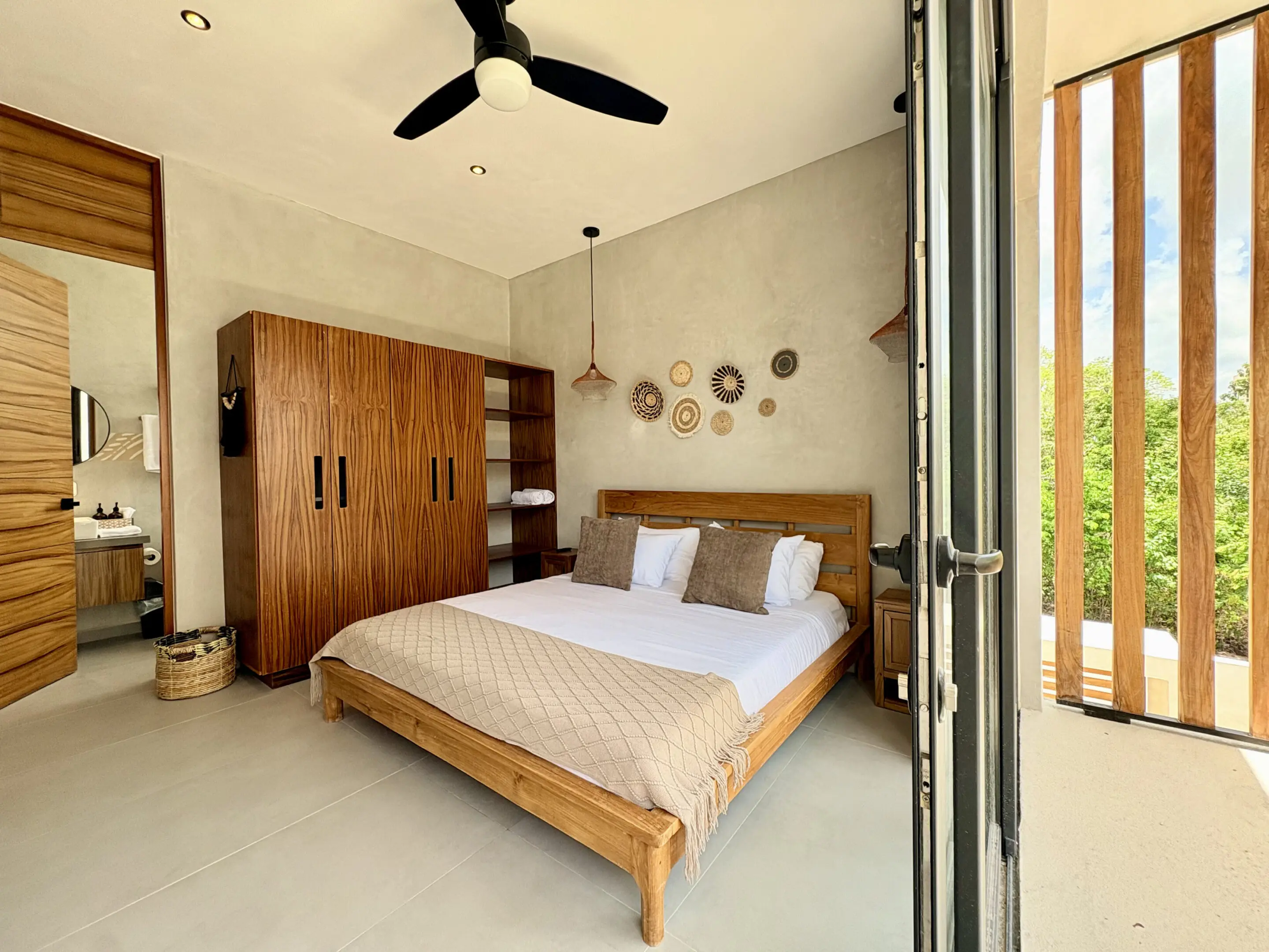 Modern minimalist bedroom with wooden bed and wardrobe
