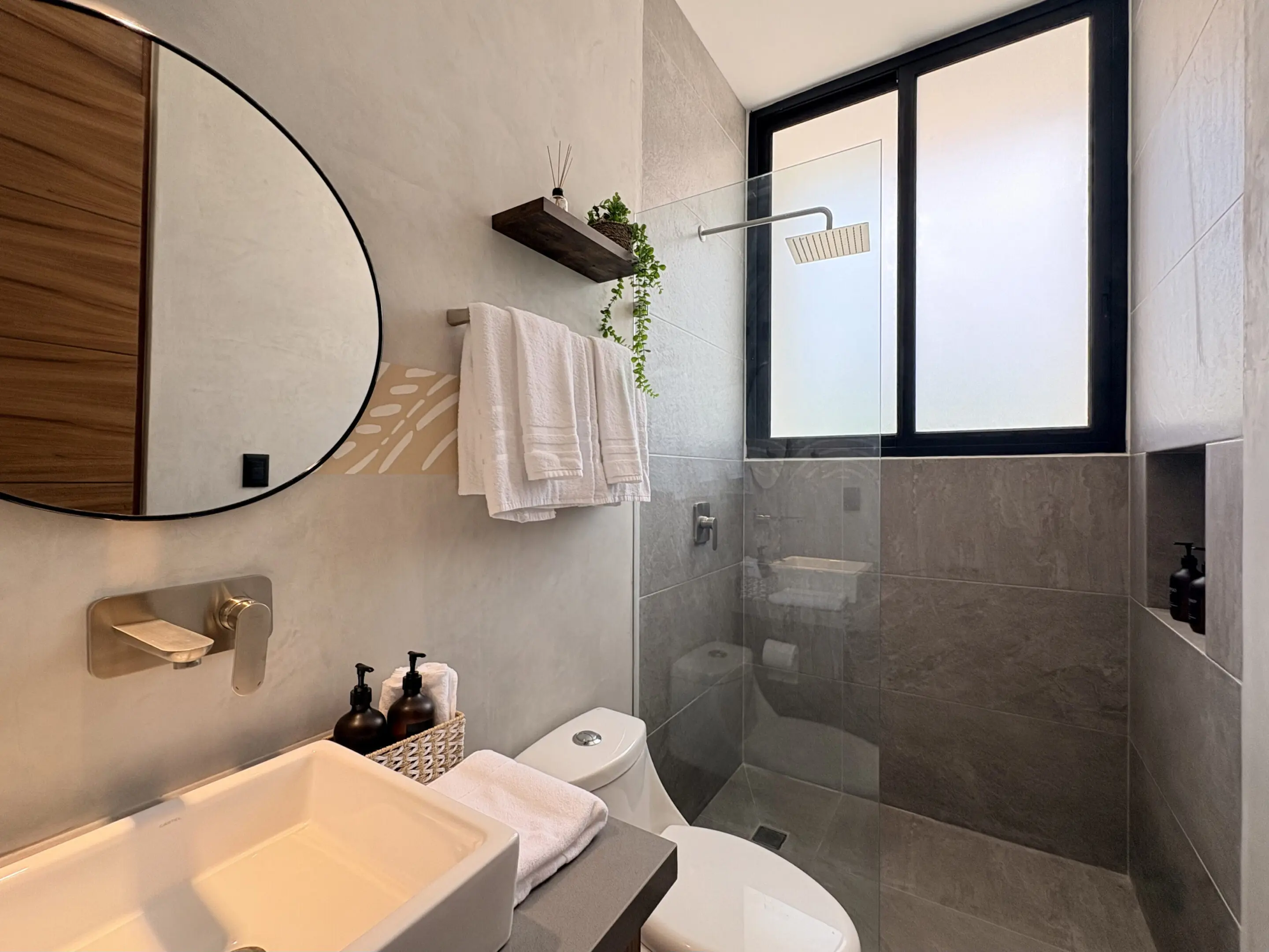 Modern gray bathroom with glass shower