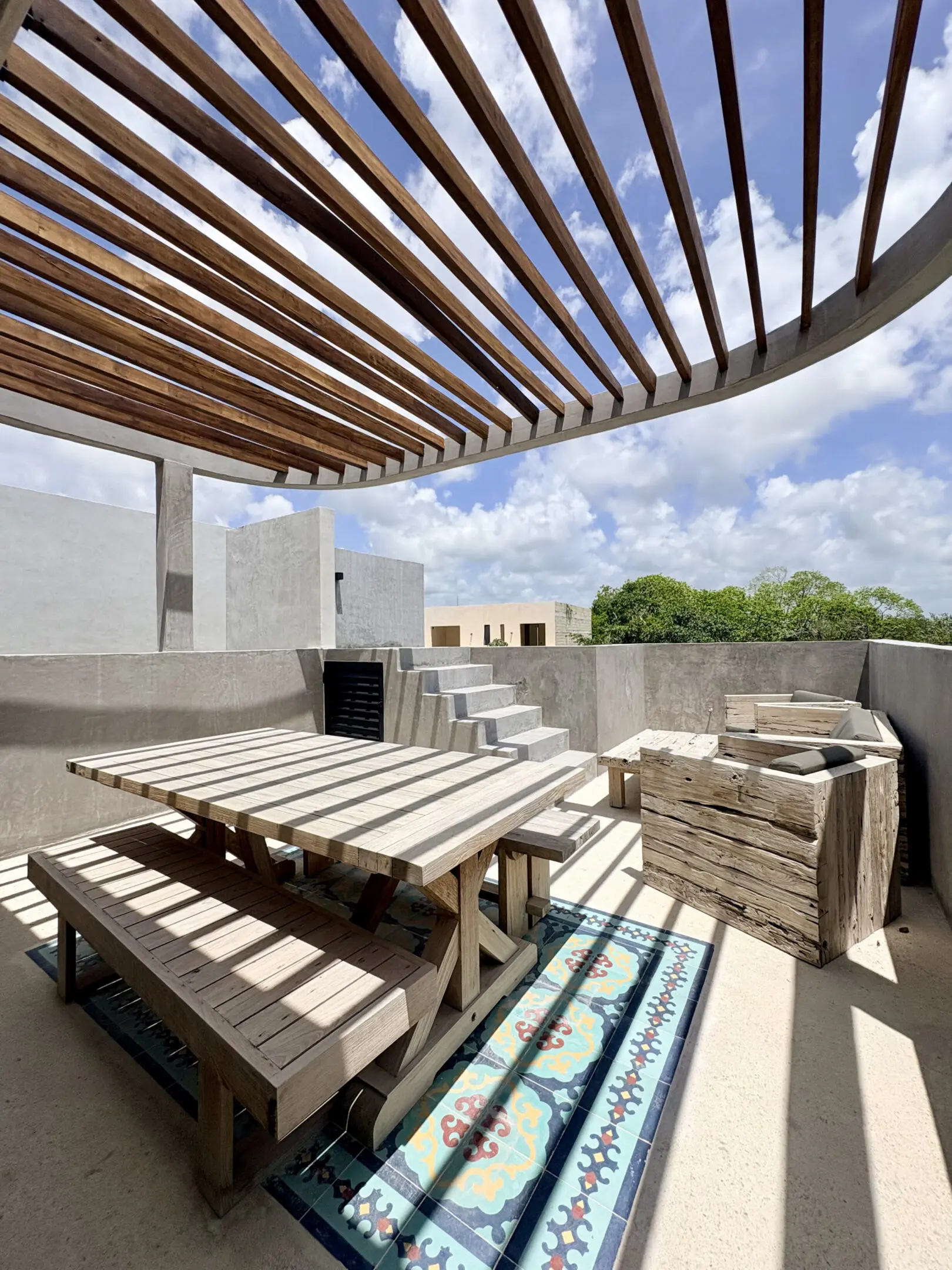 Rooftop terrace with pergola and wooden seating