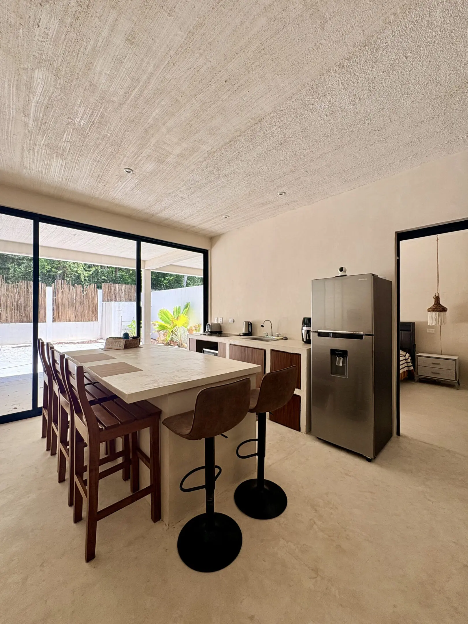 Modern kitchen island, stools, sliding glass doors