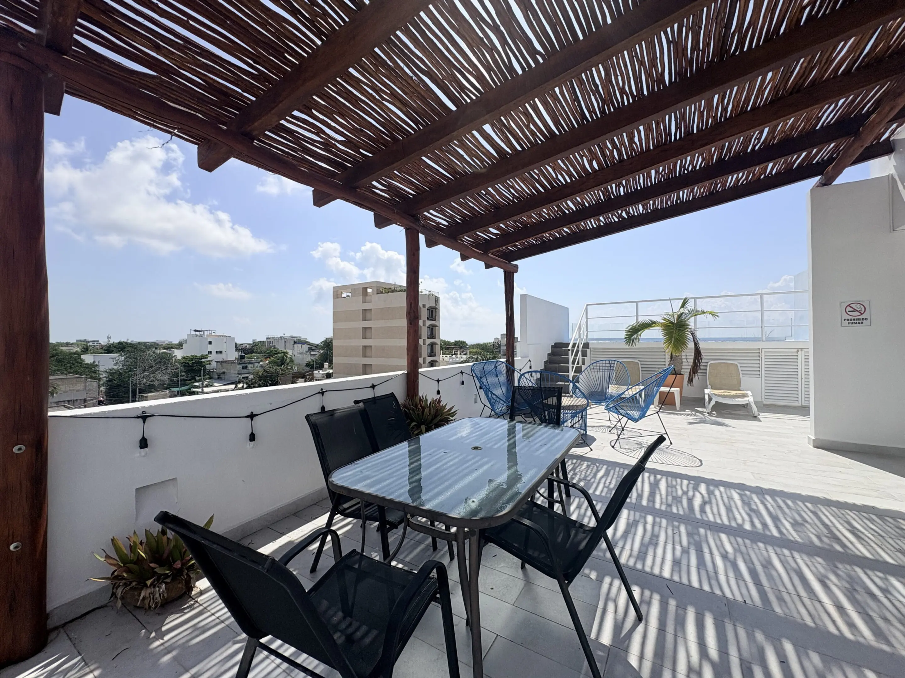Rooftop terrace with pergola and outdoor seating