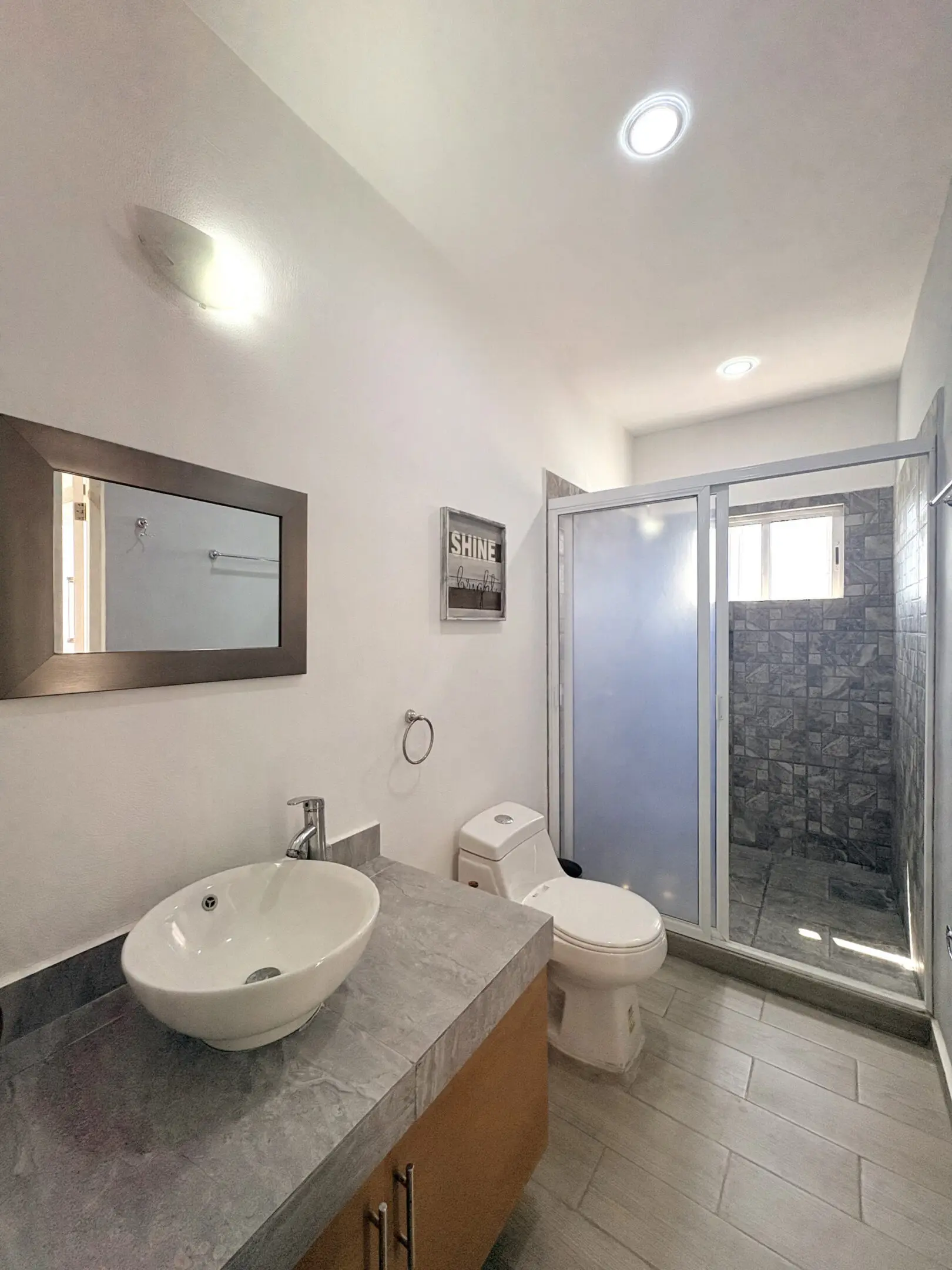 Modern bathroom with vessel sink and shower