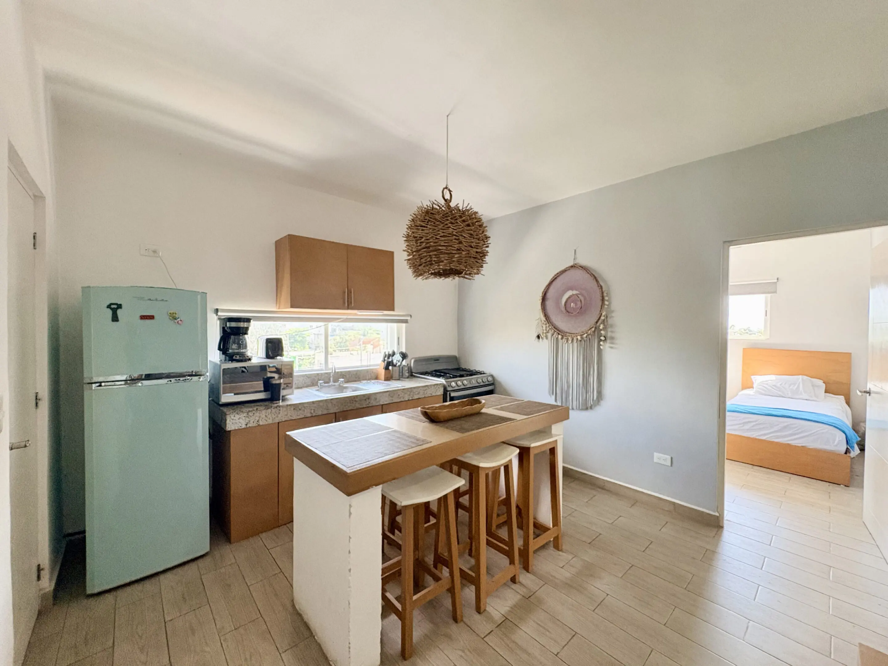 Open kitchen with island and retro refrigerator