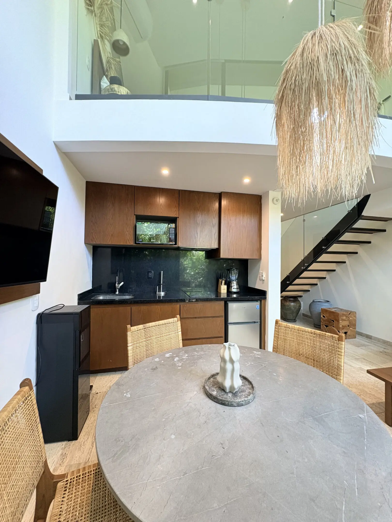 Modern loft kitchen with round dining table