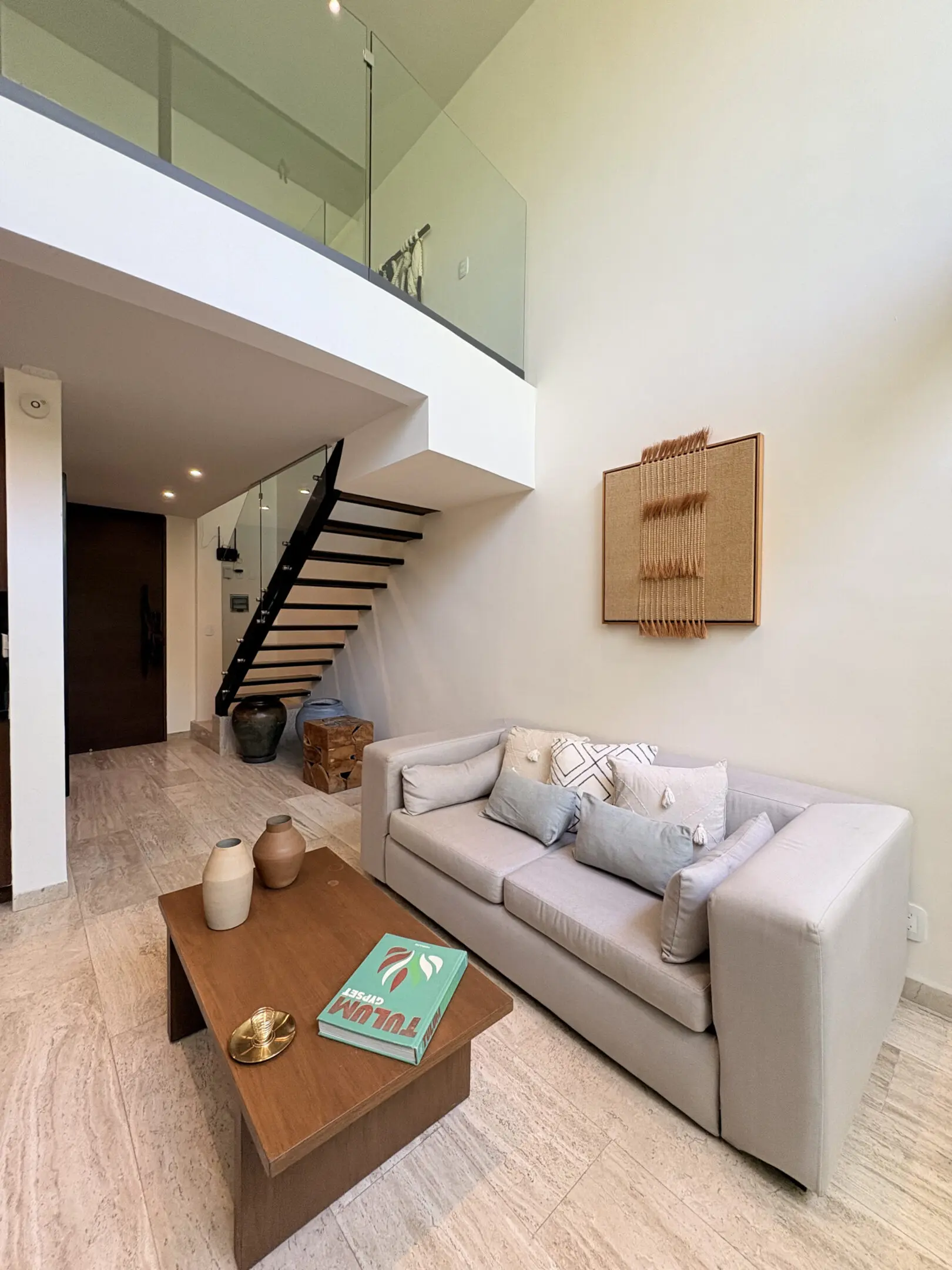 Modern living room with sofa and staircase
