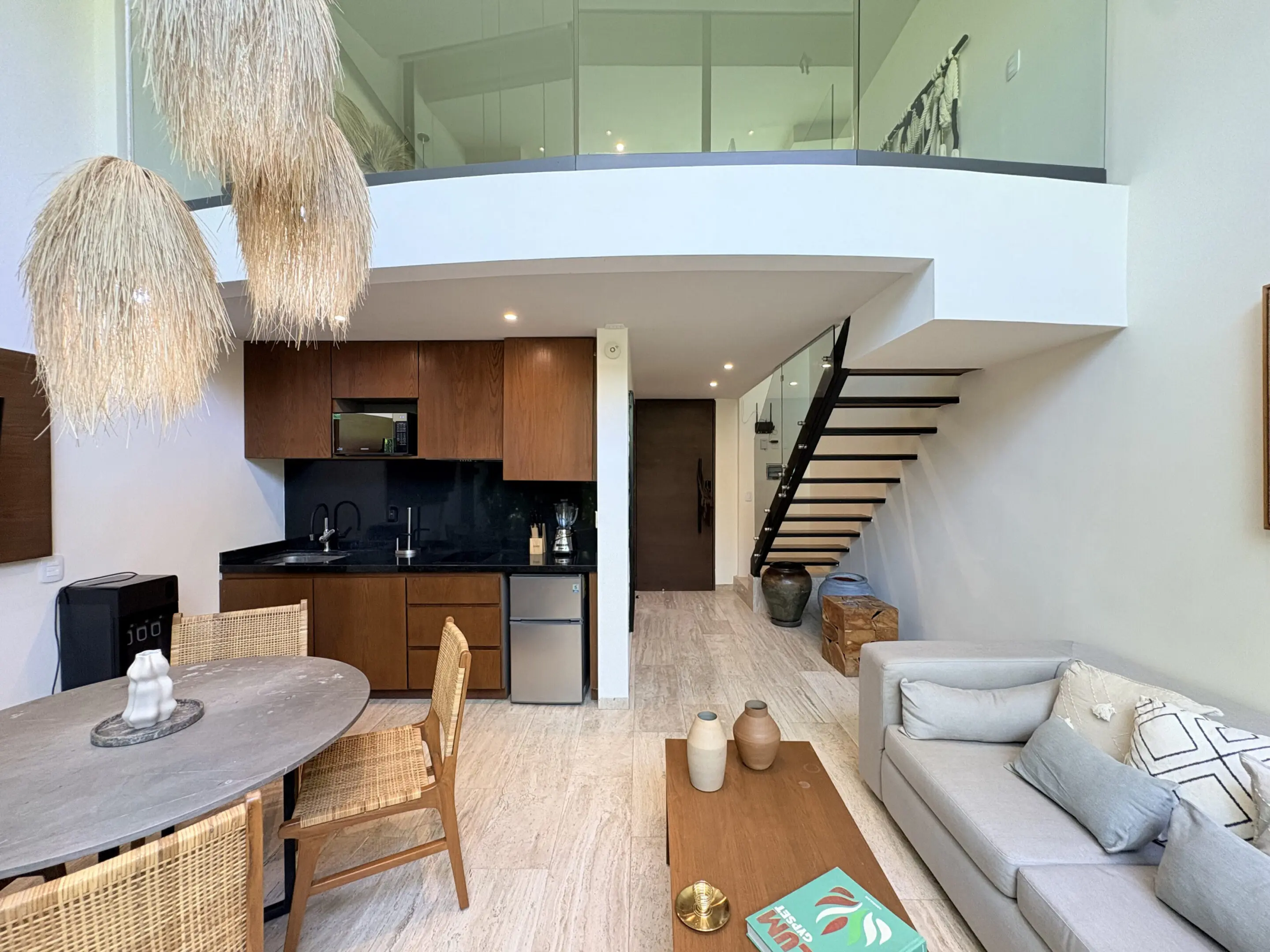 Modern loft living room with kitchen and staircase