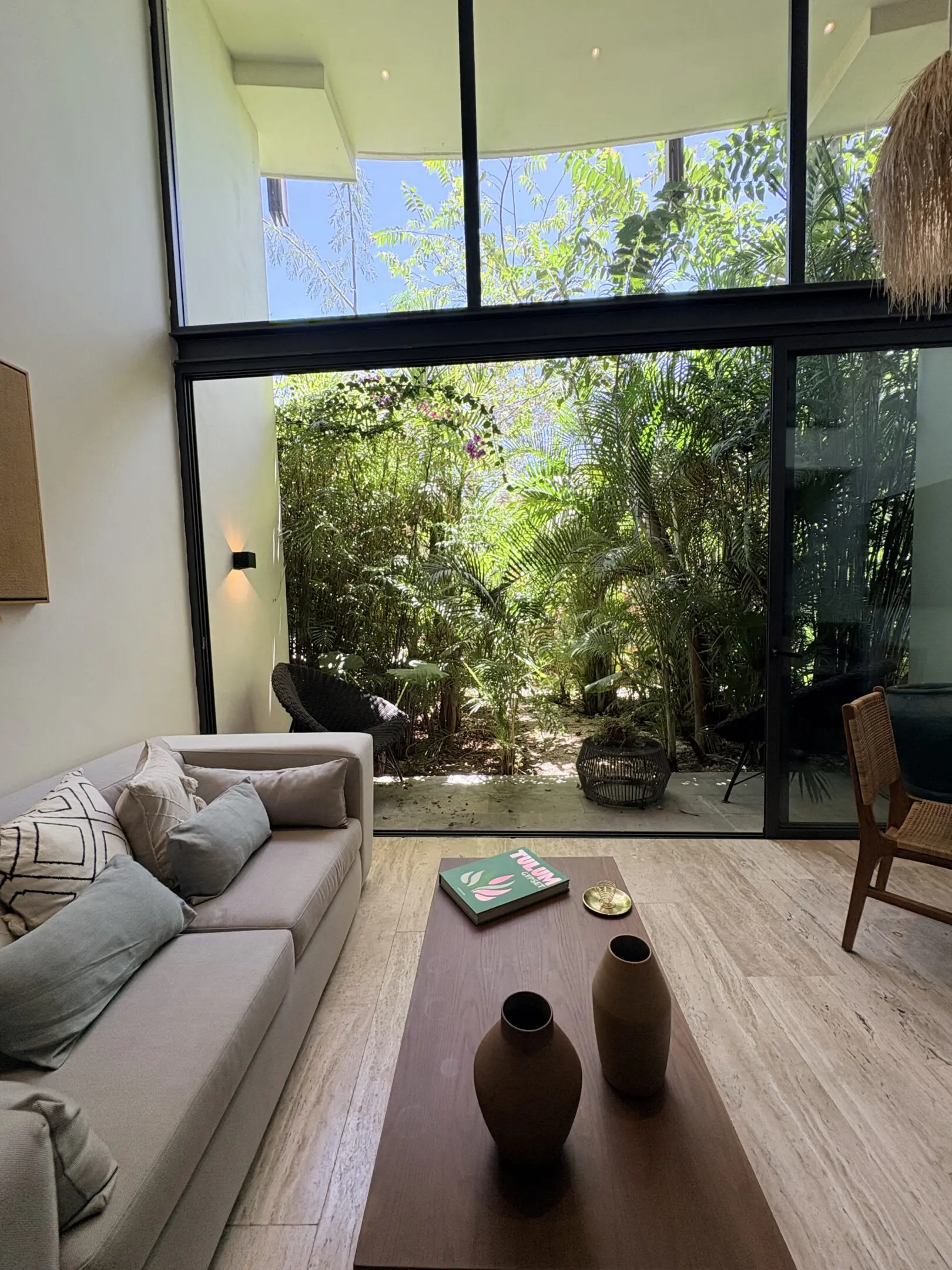 Modern living room opening to tropical garden