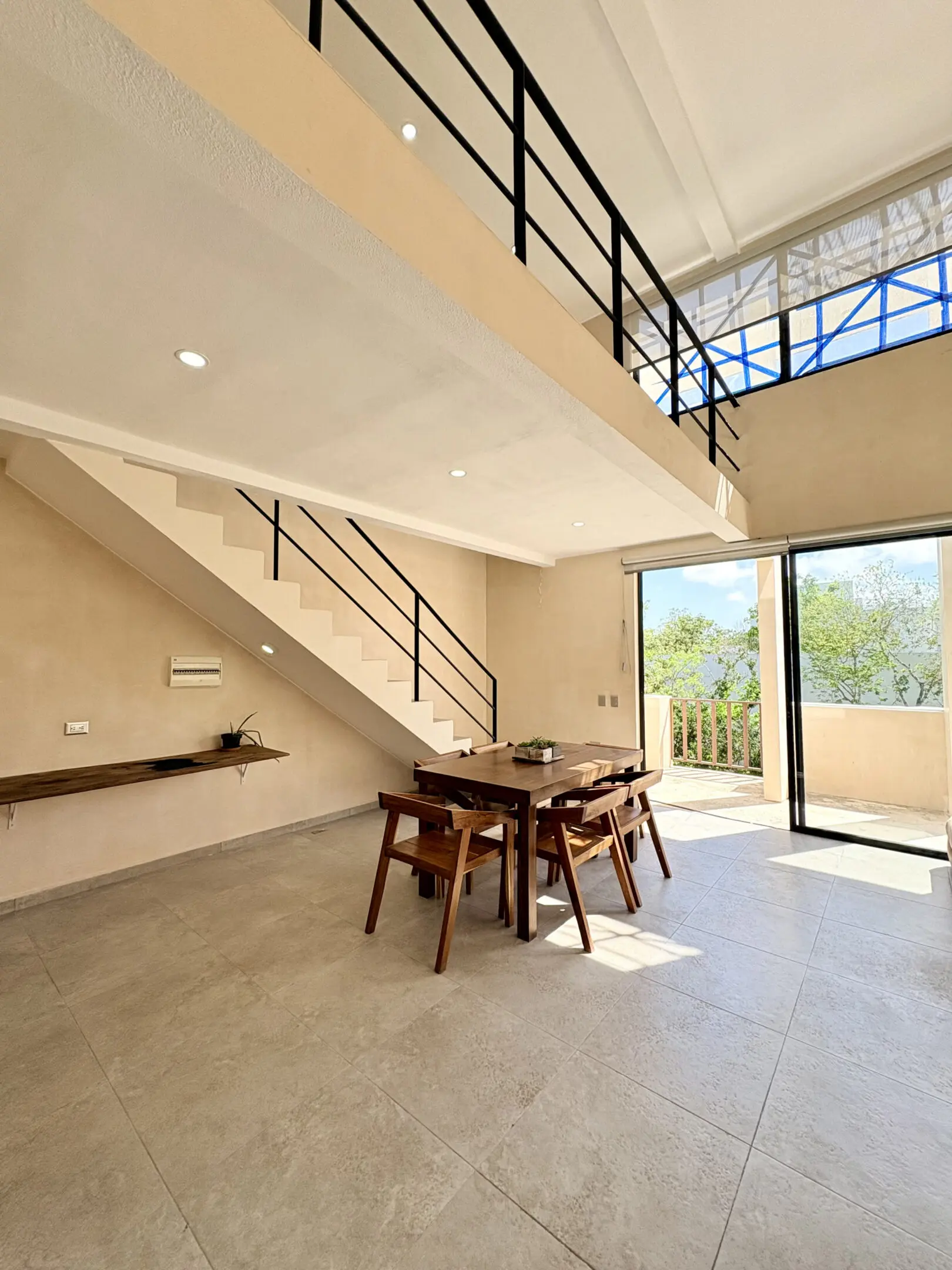 Modern loft dining area with staircase