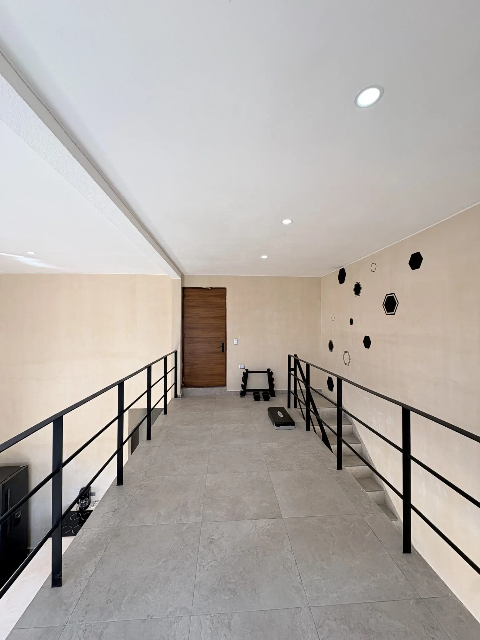 Mezzanine walkway with hexagon wall art