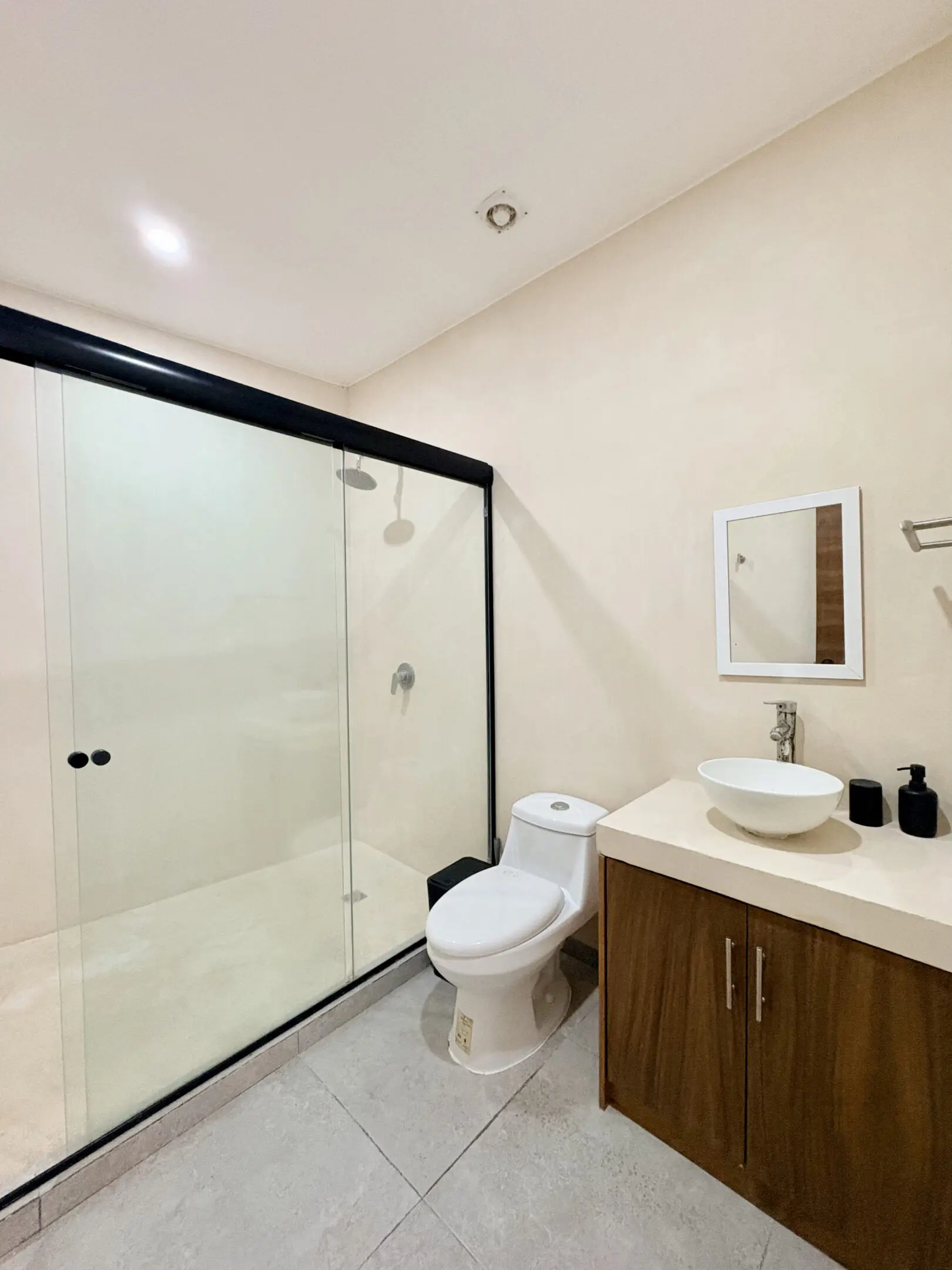 Modern bathroom with glass shower and vanity