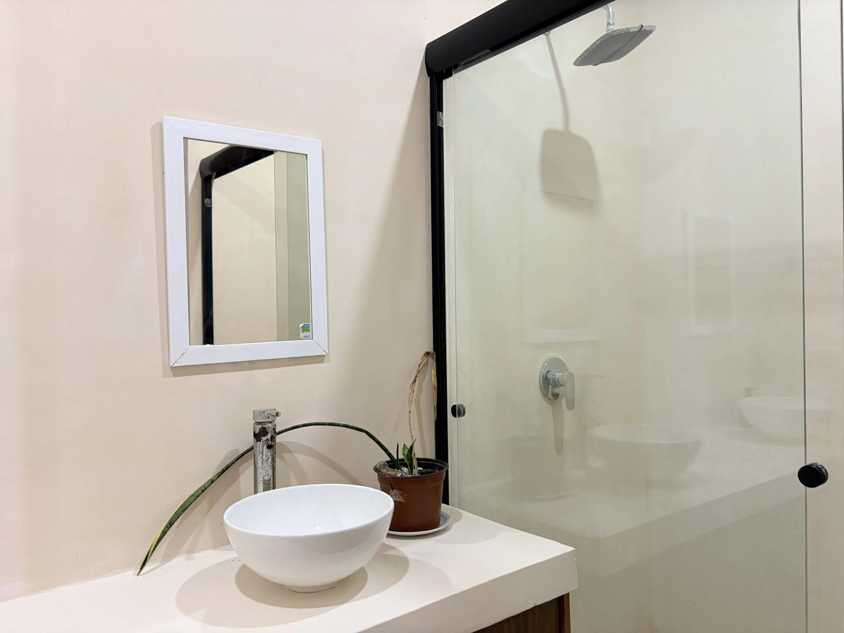 Modern bathroom with vessel sink and glass shower