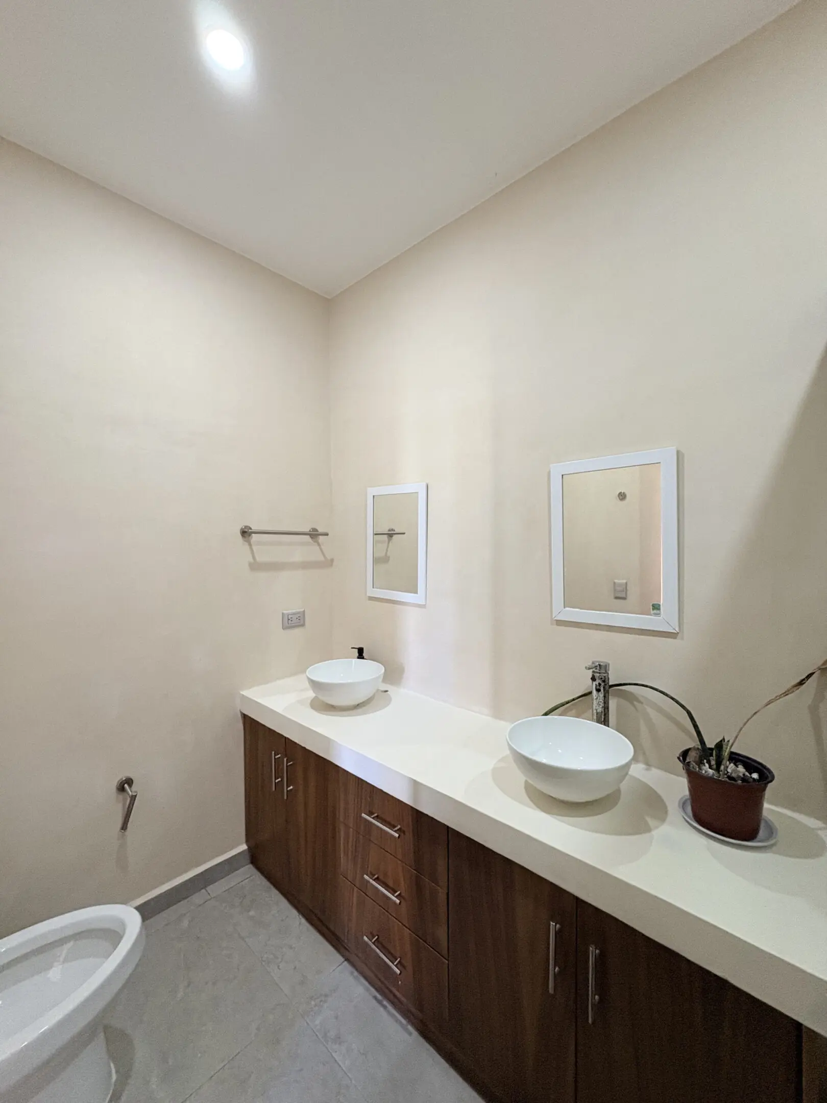 Bathroom with double vessel sinks and mirrors