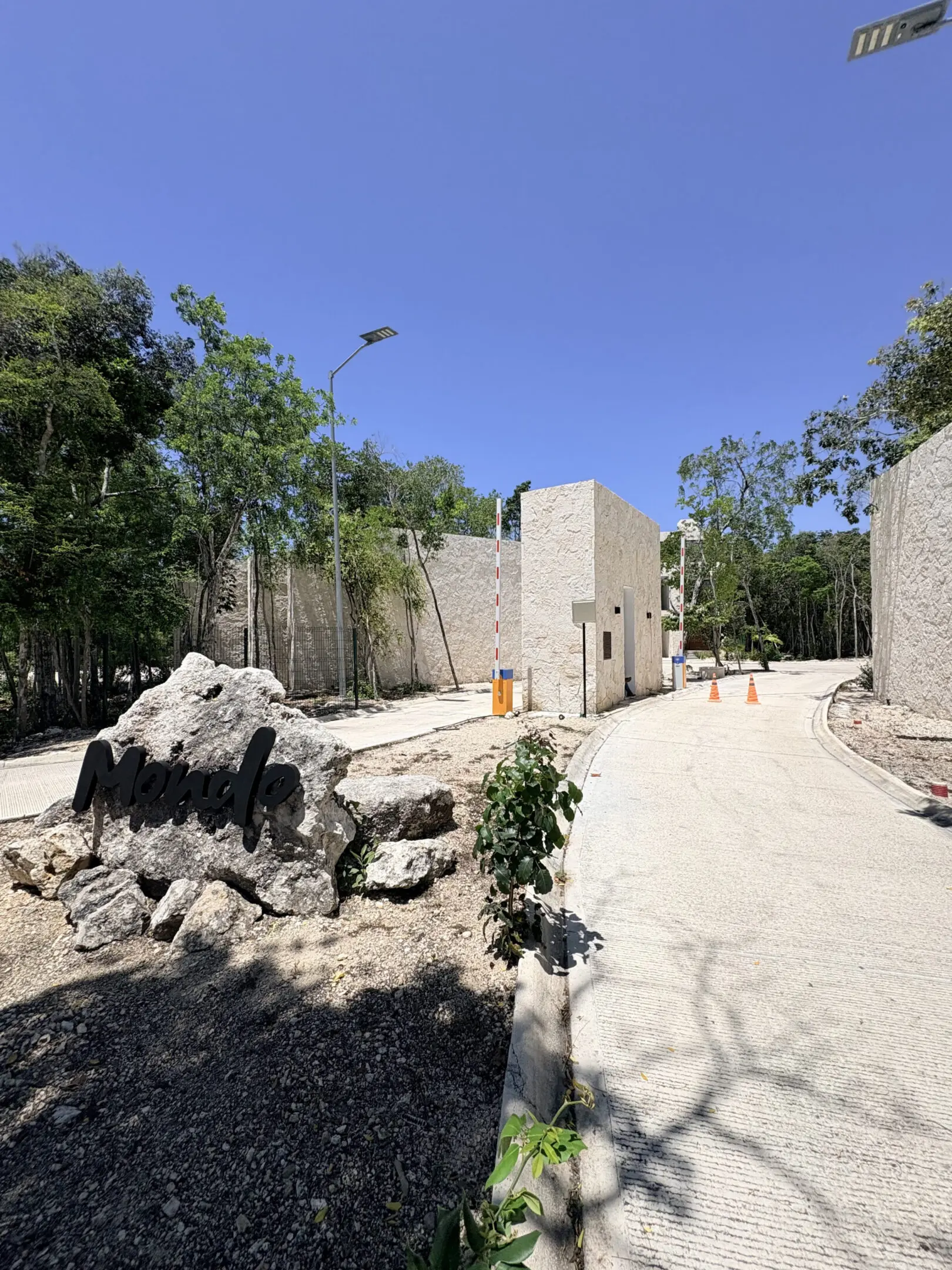 Curving stone driveway leading to resort buildings