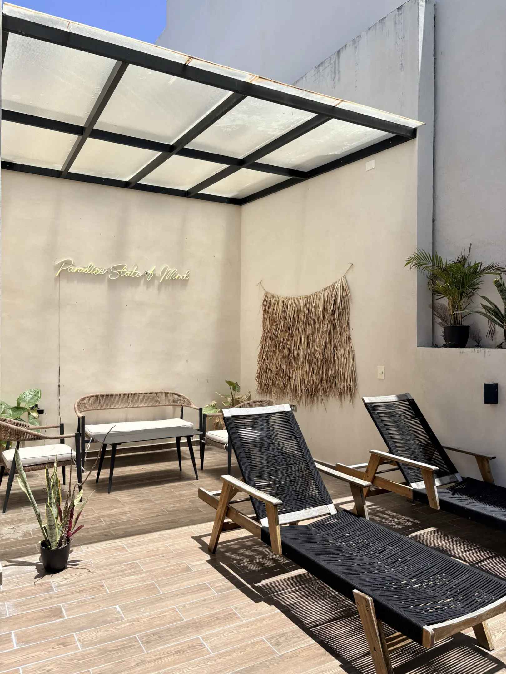 Sunlit patio with lounge chairs and seating