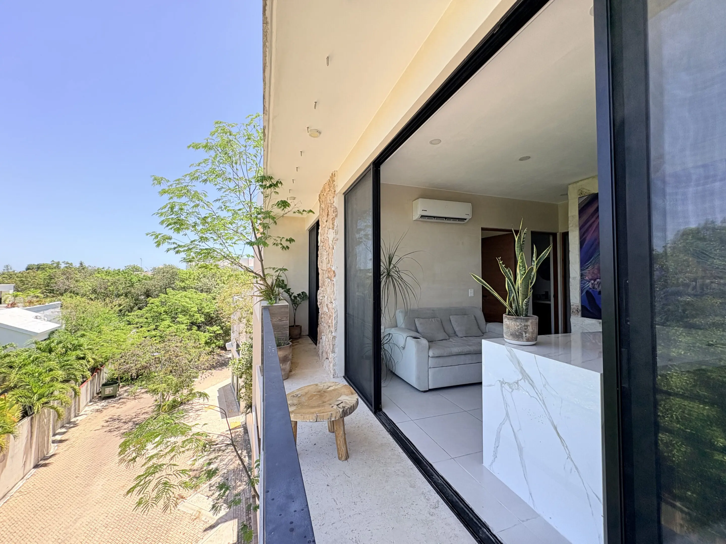 Balcony view of modern apartment with potted plants