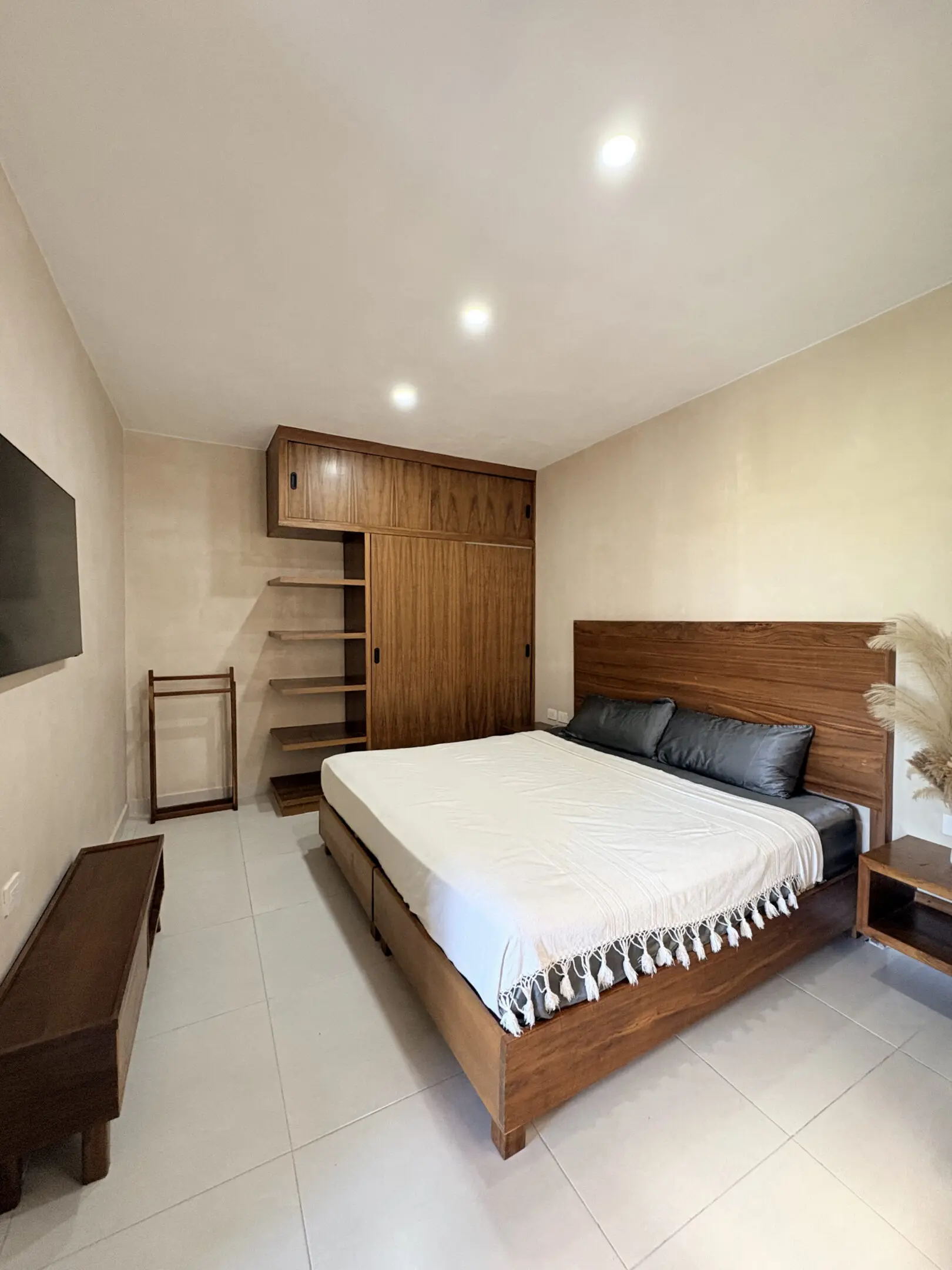 Modern minimalist bedroom with wooden bed
