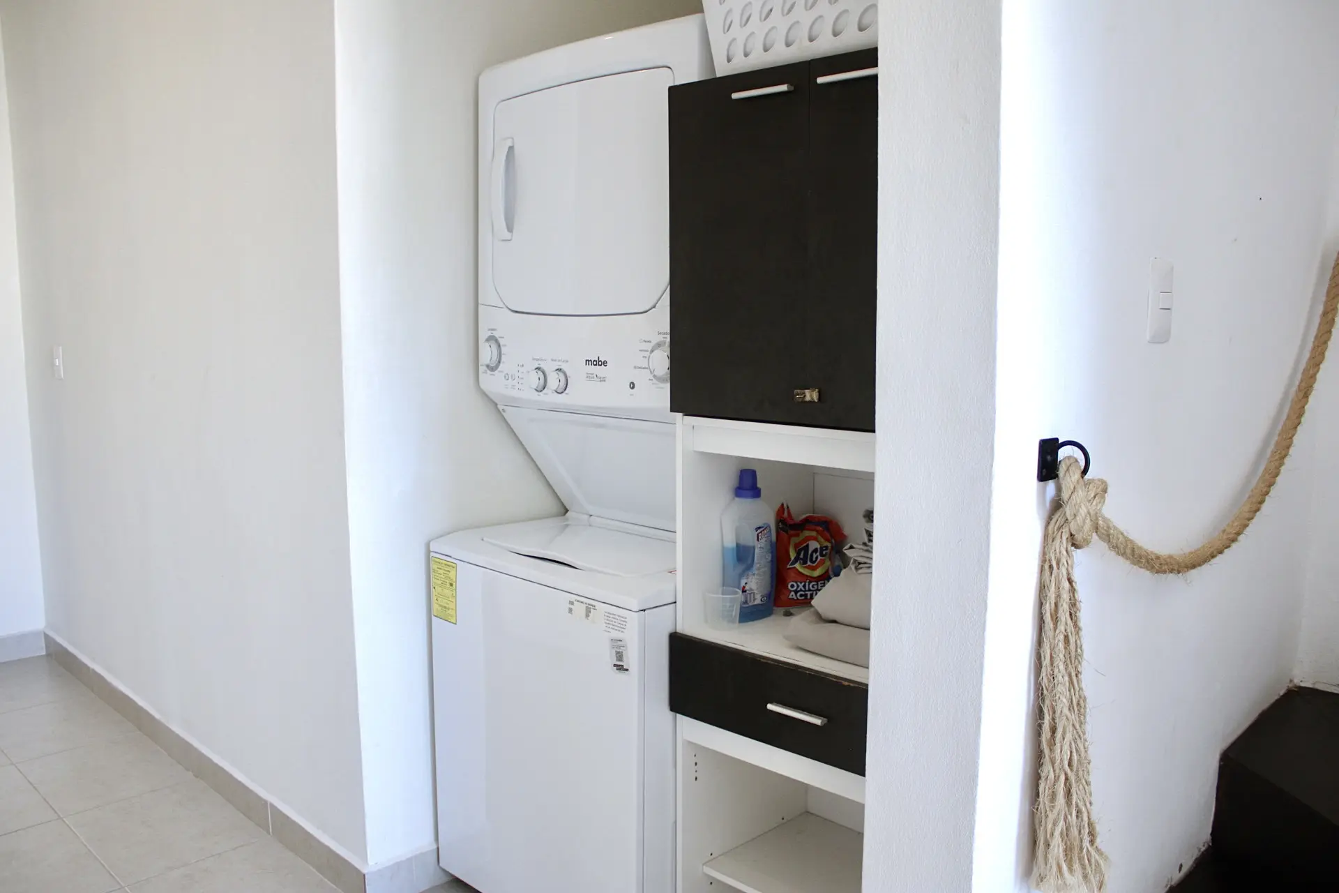 Stacked washer and dryer in laundry closet