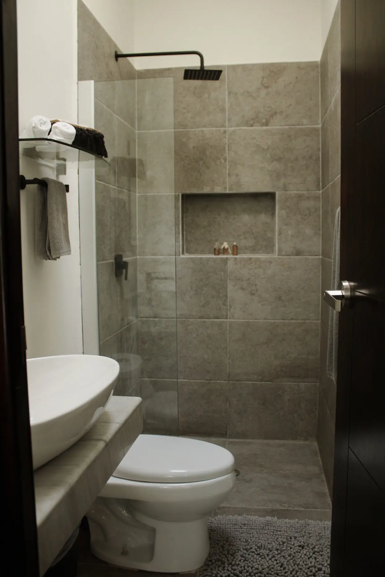 Modern gray tiled bathroom with walk-in shower