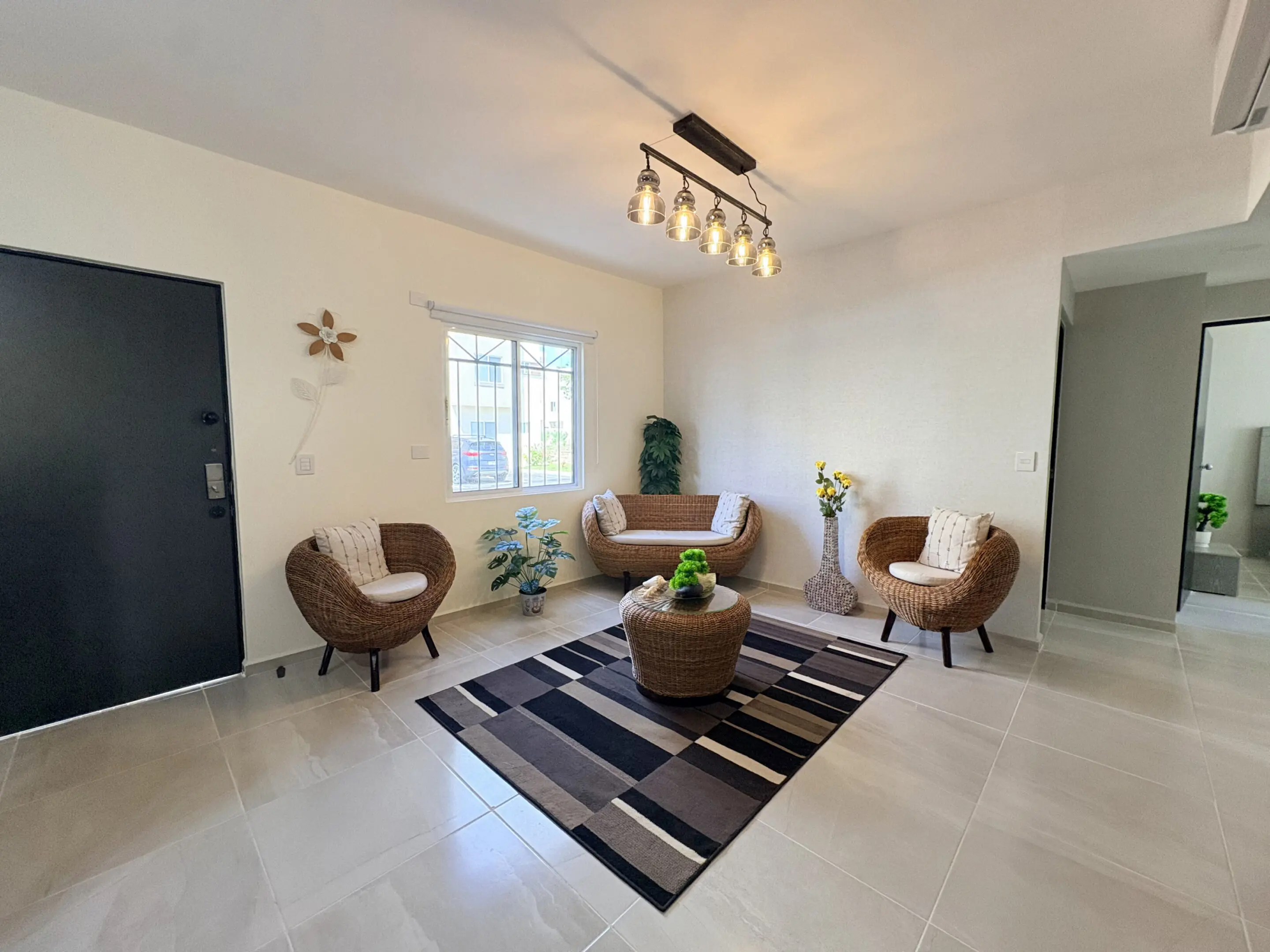 Modern living room with wicker chairs and rug
