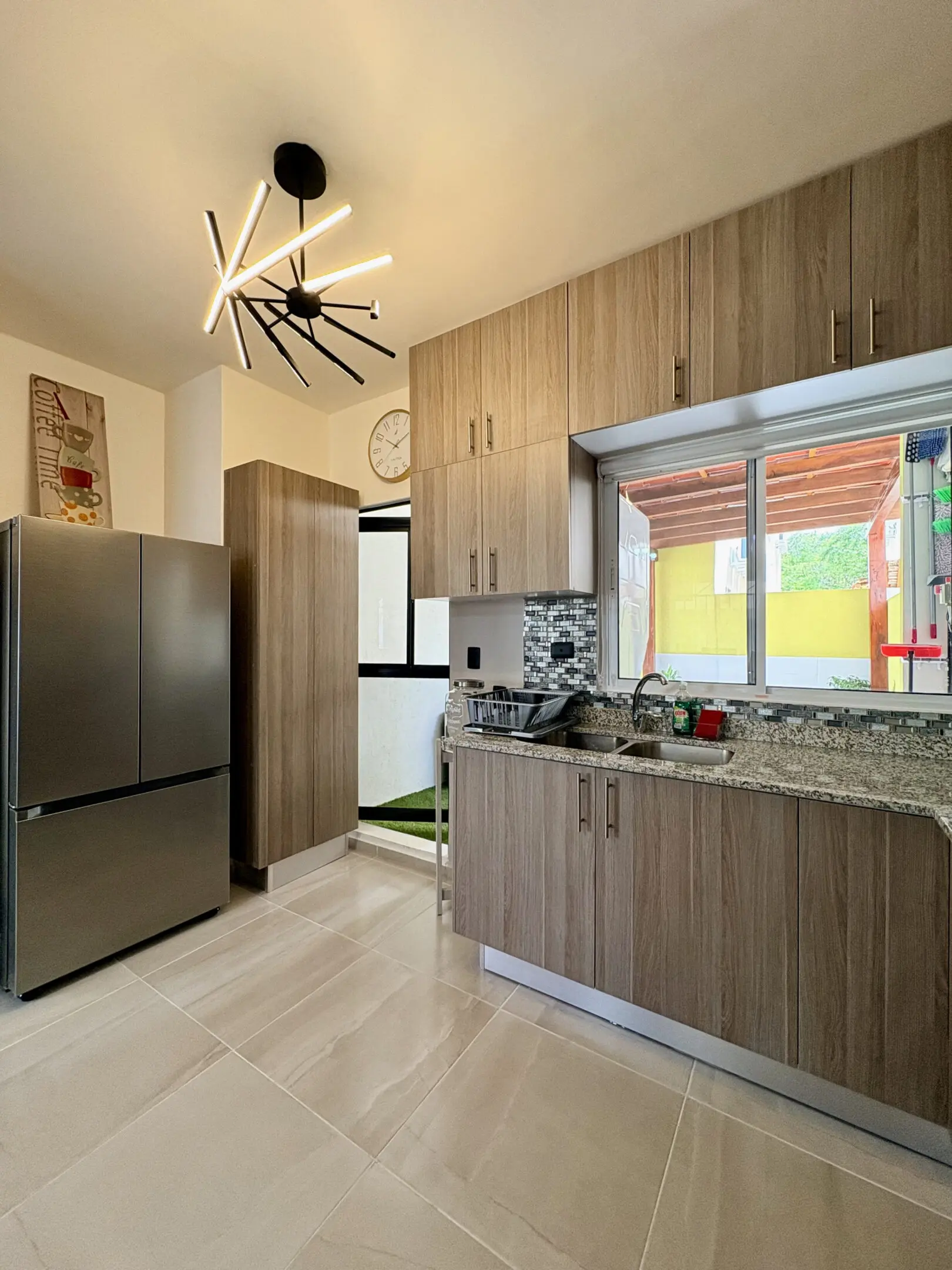 Modern kitchen with wood cabinets and granite countertop