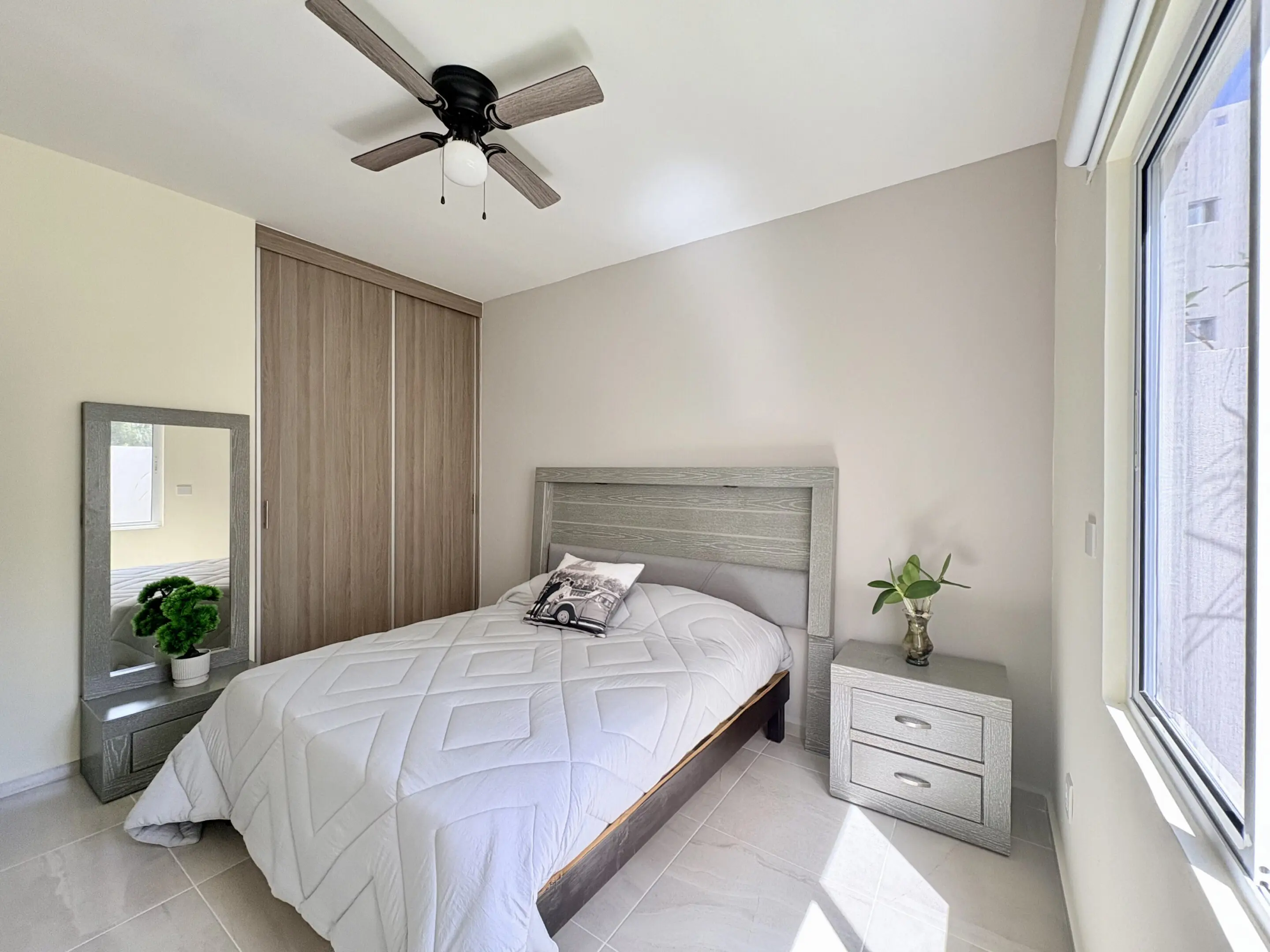 Bright modern bedroom with bed and nightstand