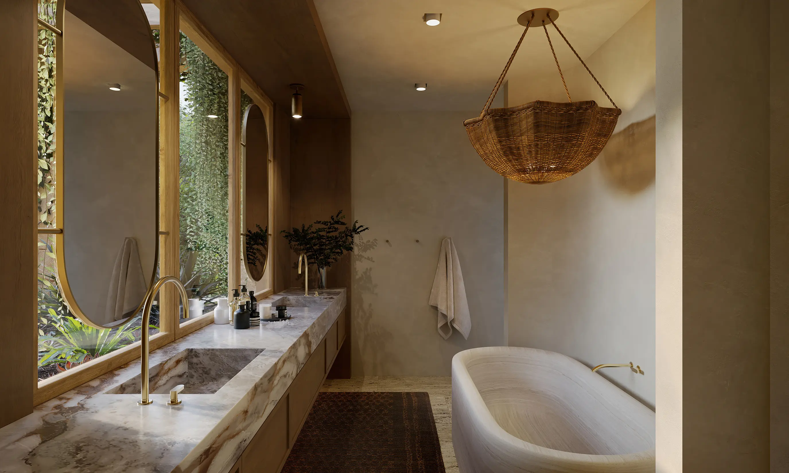Marble vanity and freestanding tub in warm bathroom