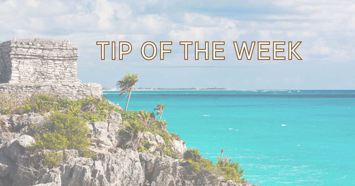 Cliffside Mayan ruins overlooking turquoise Caribbean sea