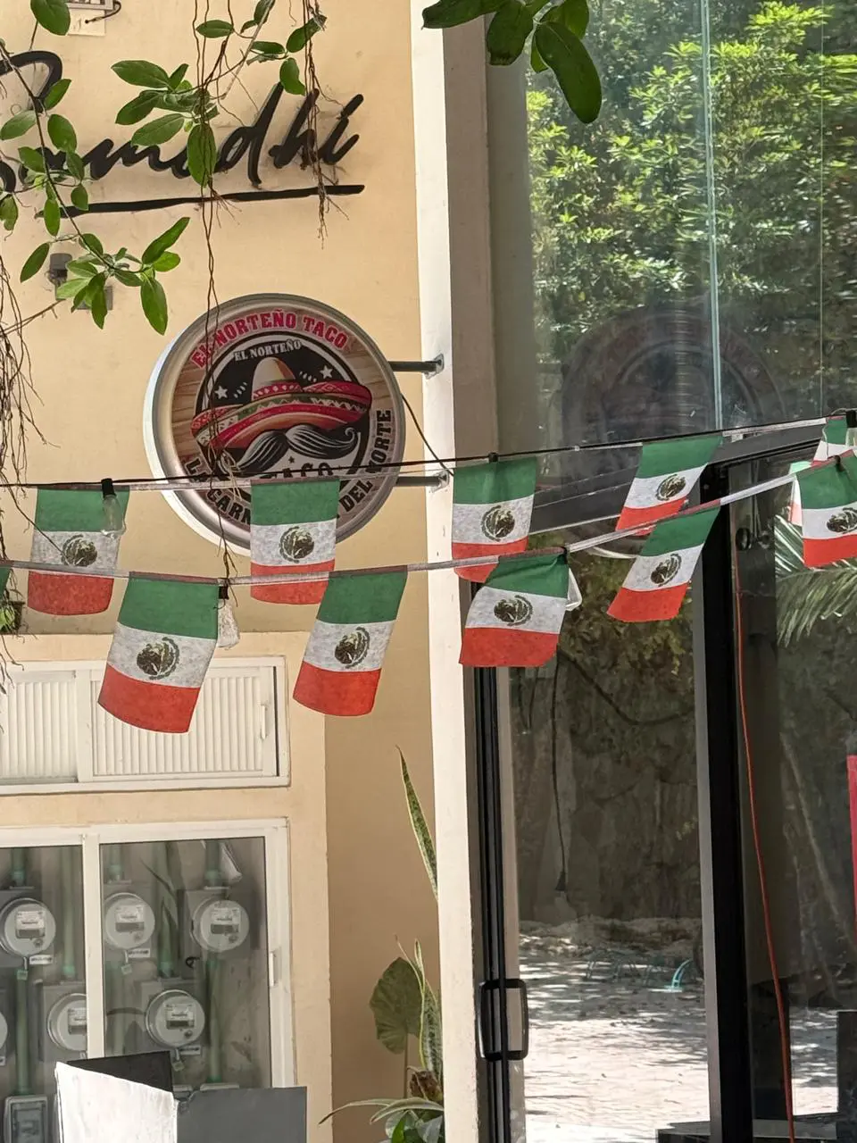 Mexican flag bunting at restaurant entrance