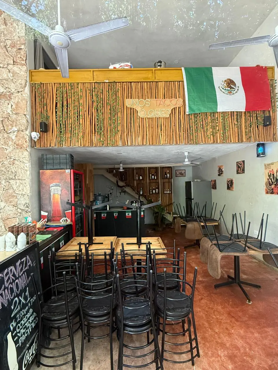 Empty Mexican restaurant interior with stacked chairs
