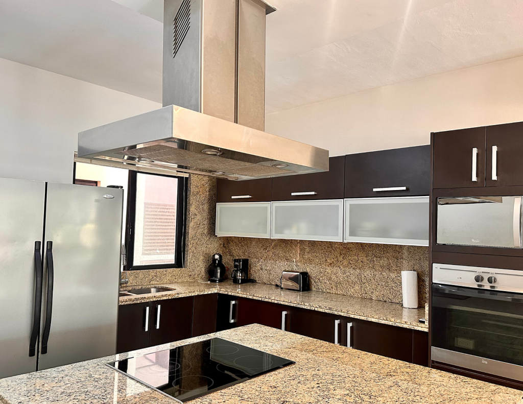 Modern kitchen with stainless range hood