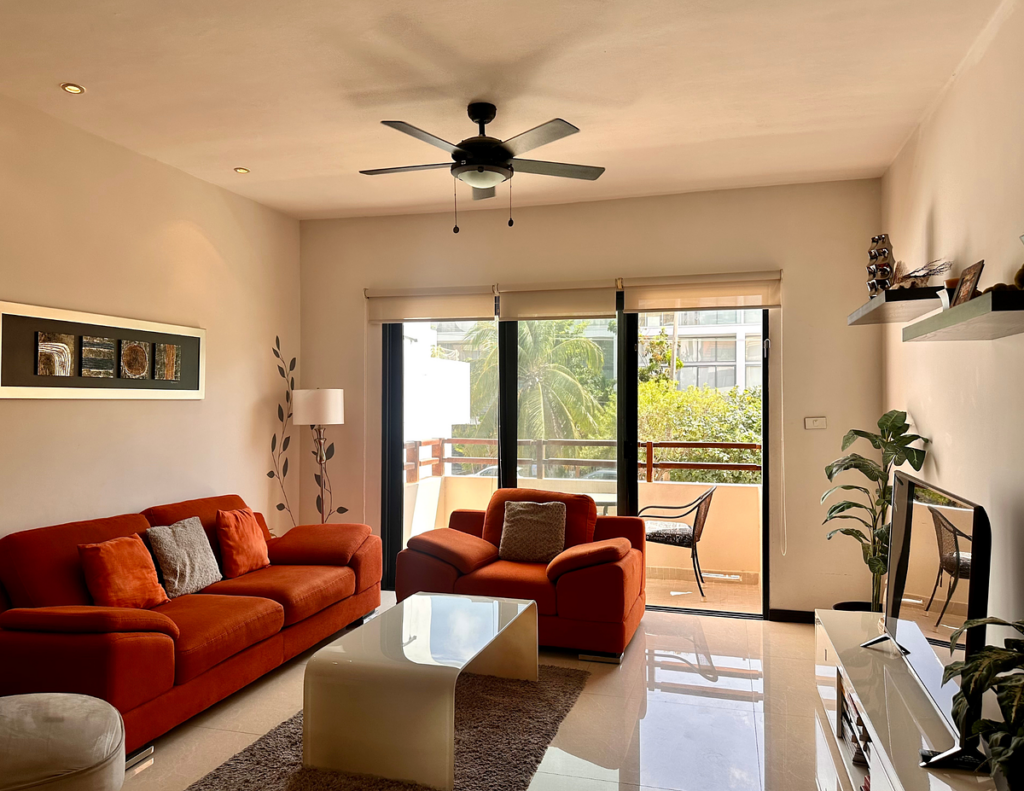 Modern living room with red sofas and balcony
