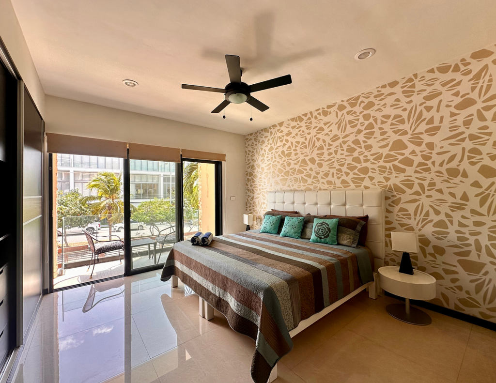 Modern bedroom with balcony, patterned accent wall
