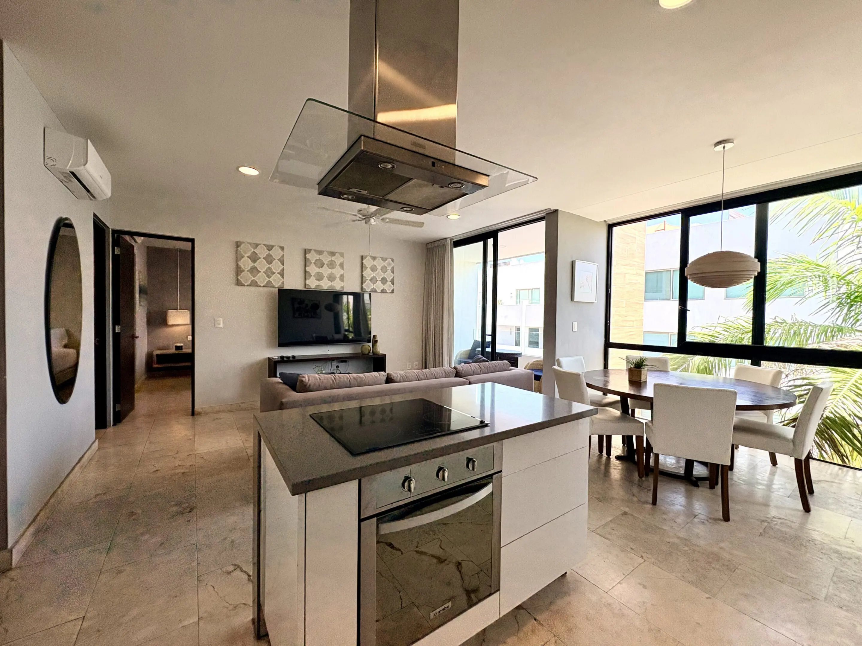 Modern open-plan kitchen island with dining area