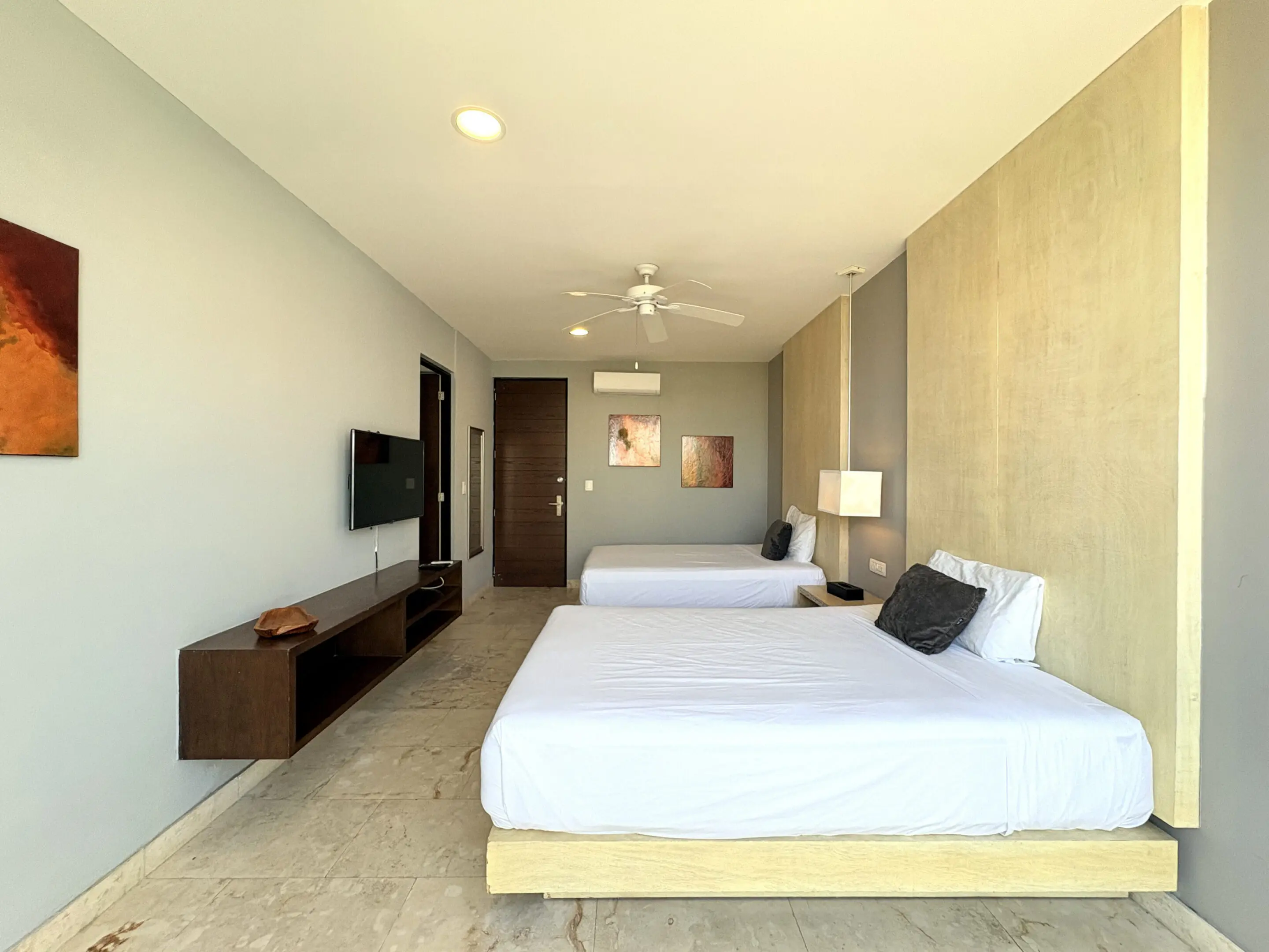 Bright modern hotel room with two beds