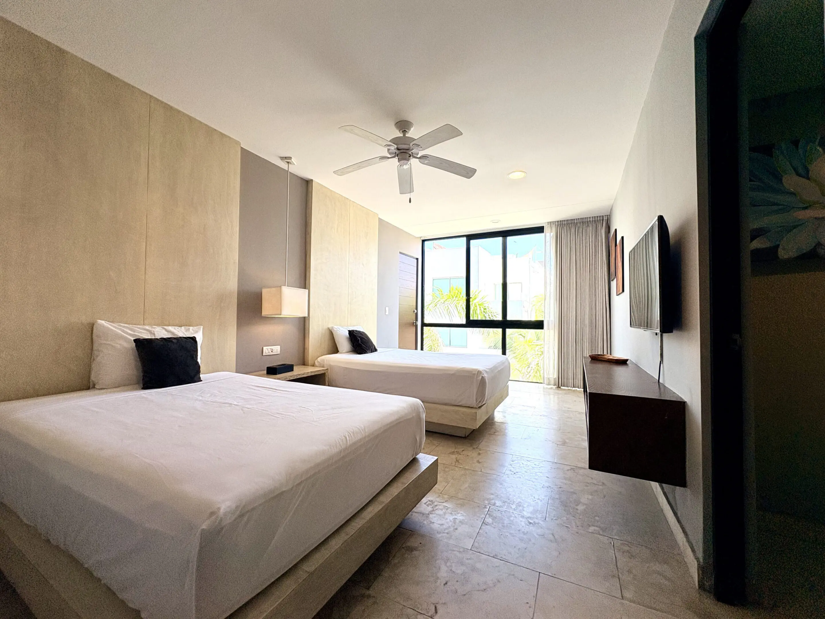 Bright modern hotel room with two beds