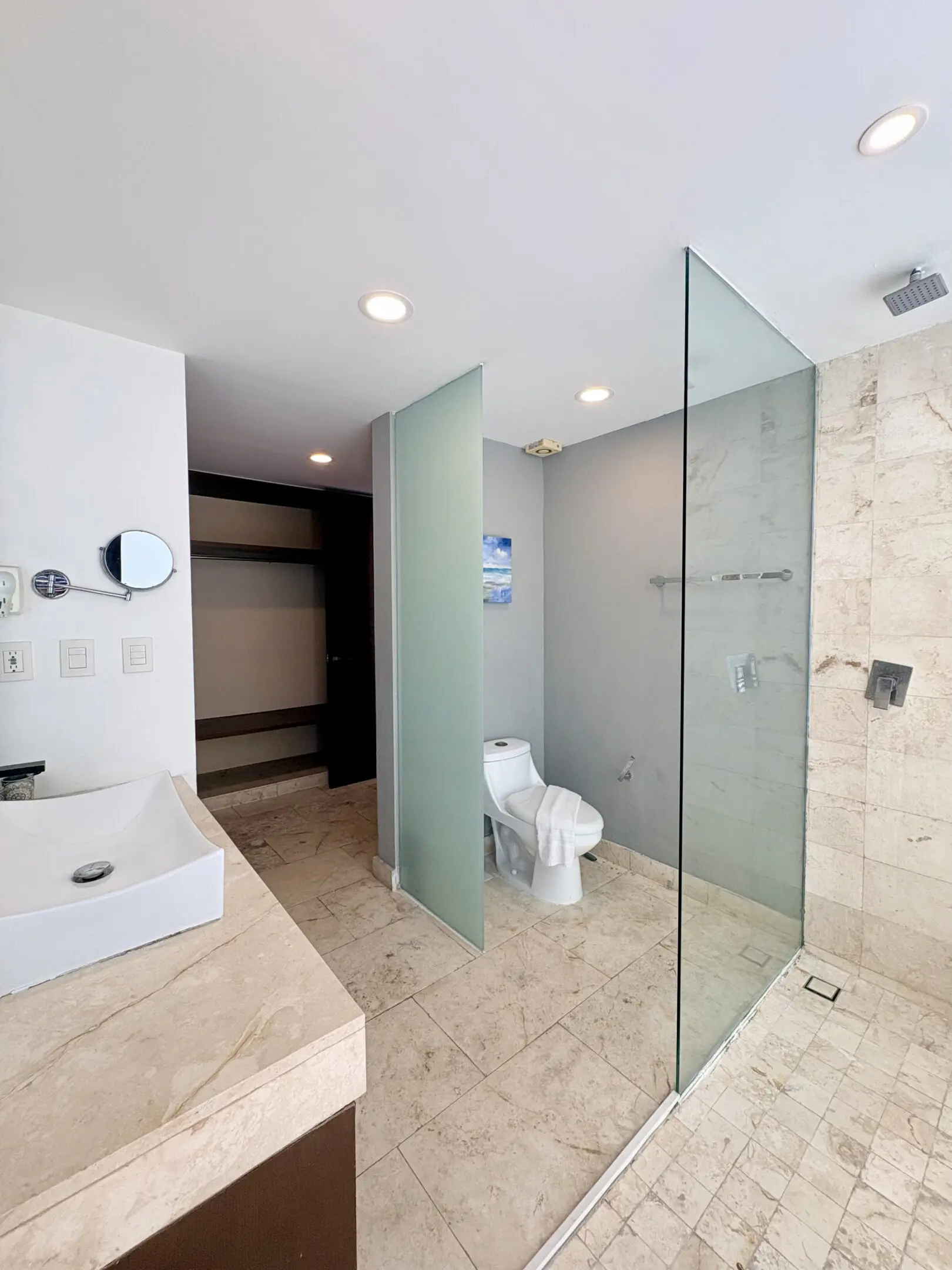 Modern bathroom with glass shower and toilet