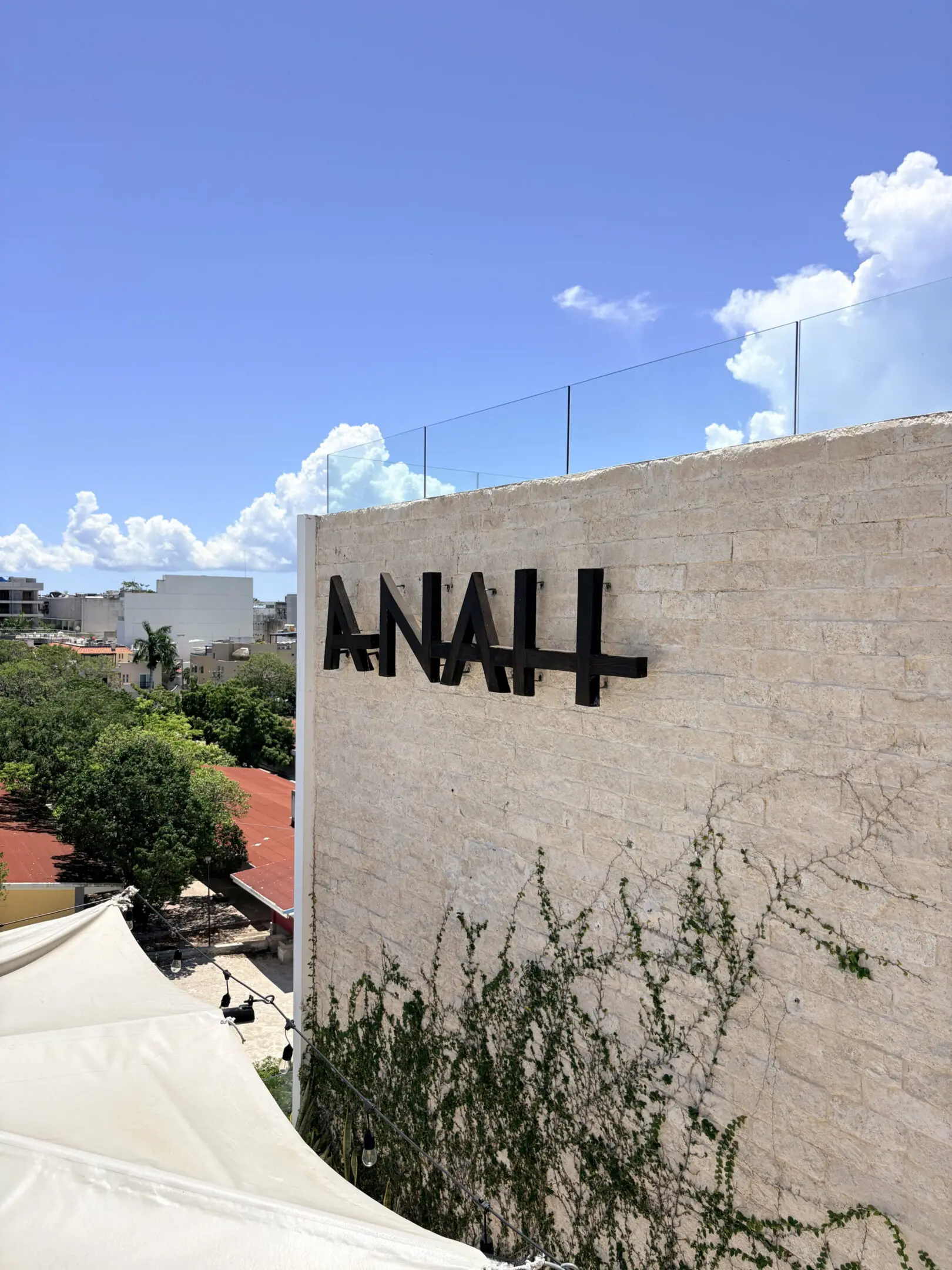 Exterior stone wall with ANAH sign