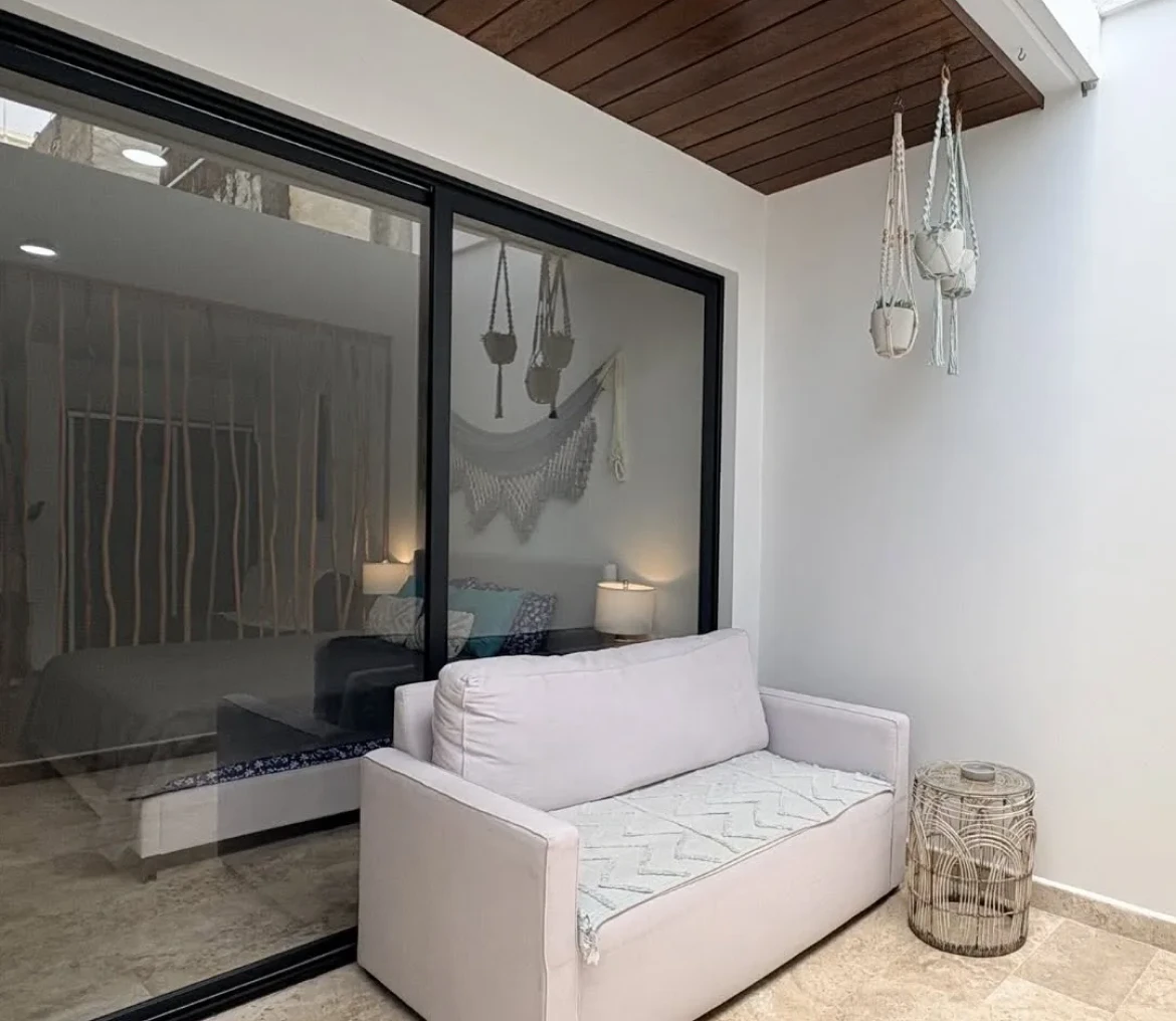 White couch on modern indoor patio.