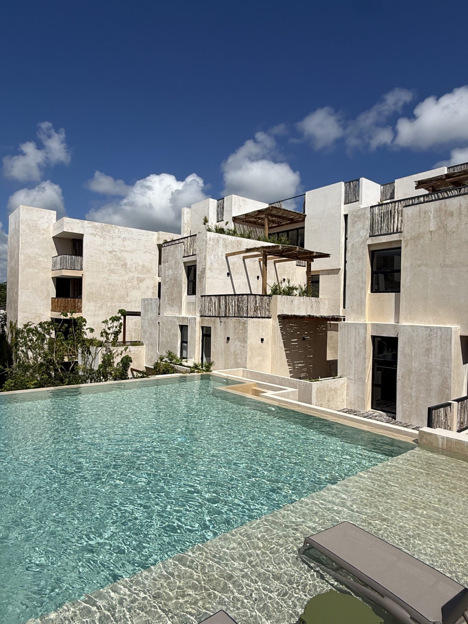 Resort pool and modern beige buildings