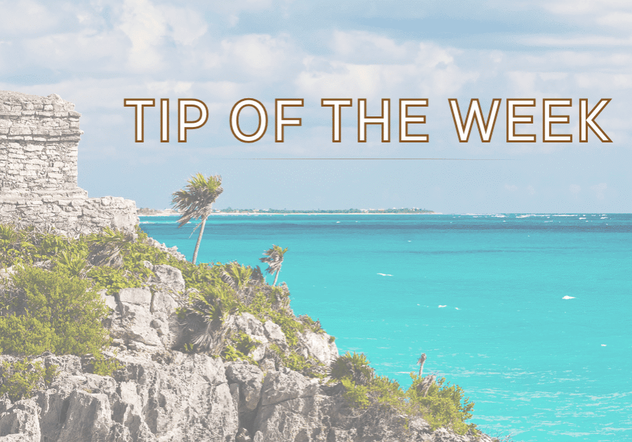 Cliffside Mayan ruins overlooking turquoise Caribbean sea