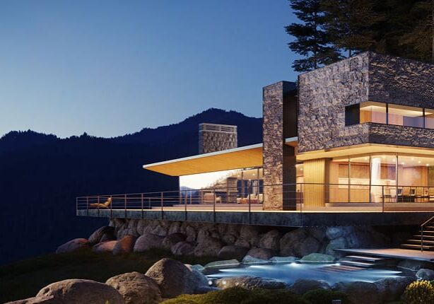 Modern house with mountain view at dusk.